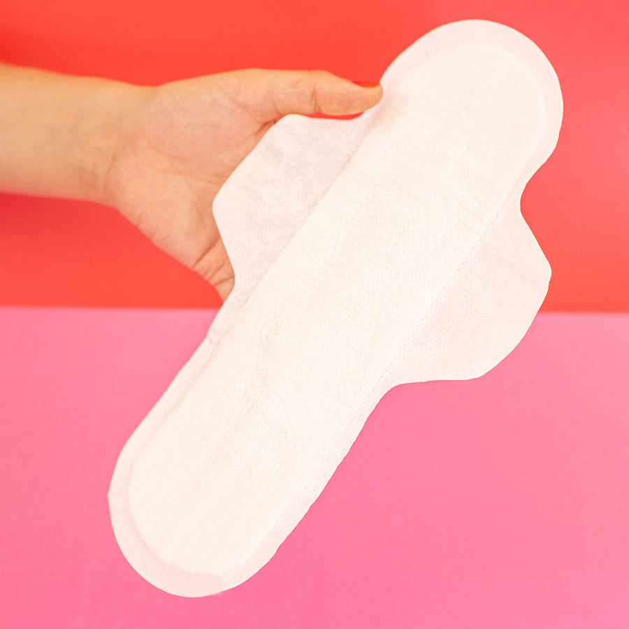 day pad and Overnight Pads on a red and pink background