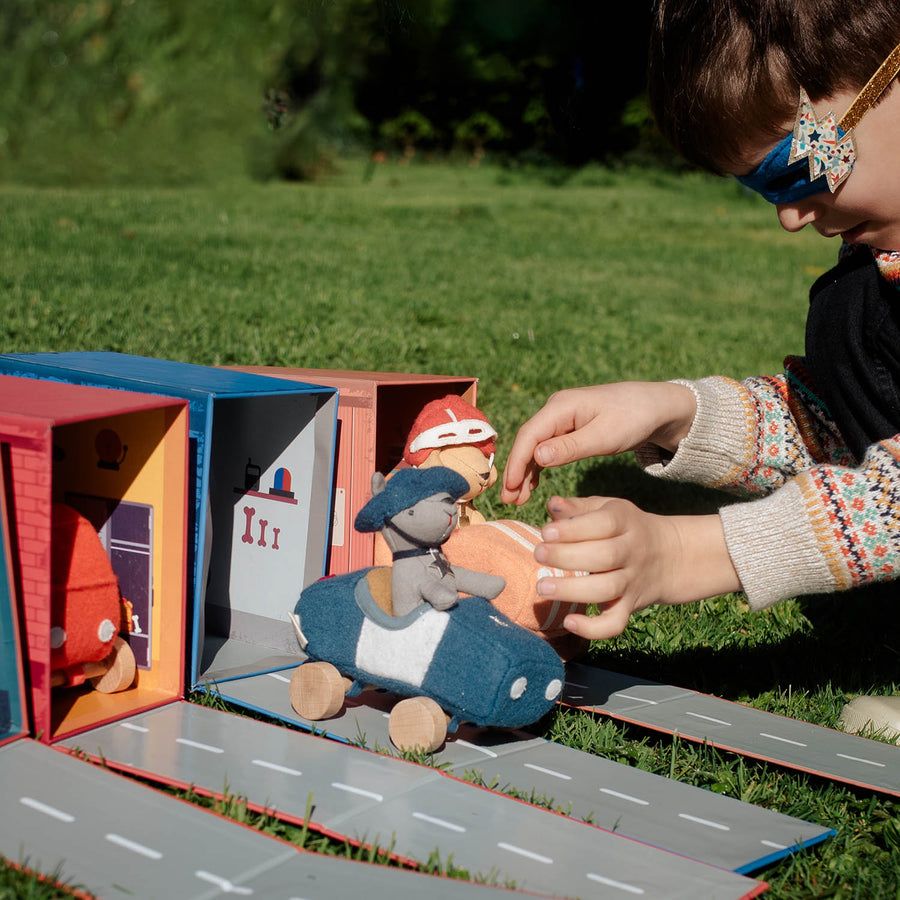 Olli Ella Holdie Dog-go Officer in a blue felt police car with wooden wheels