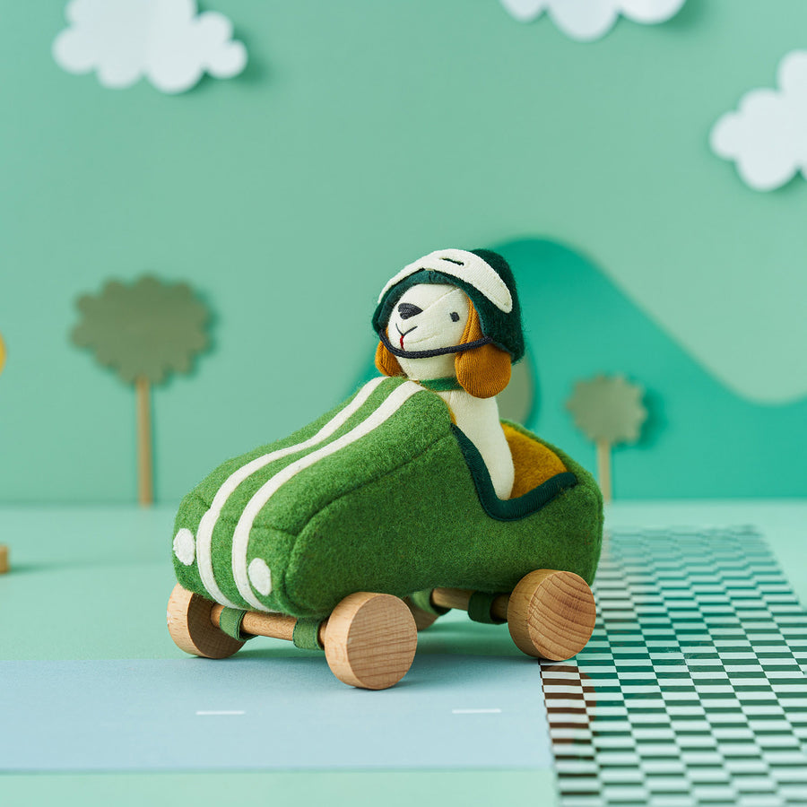 Olli Ella Holdie Dog-go Racer Boy in a green felt racing car with wooden wheels and white stripes