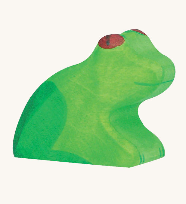 The Holztiger wooden toy frog figure on a plain background. 