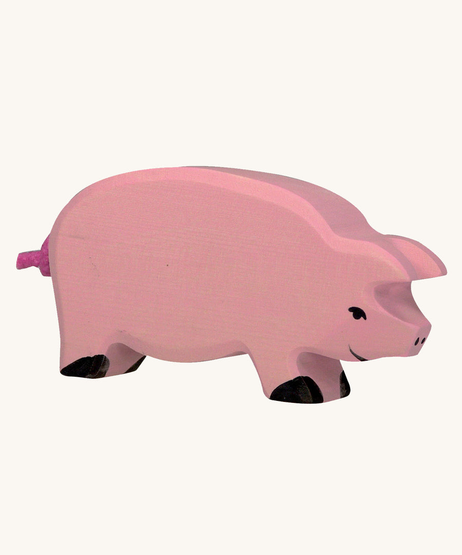 Holztiger pink Pig Toy Figure on a plain background. 