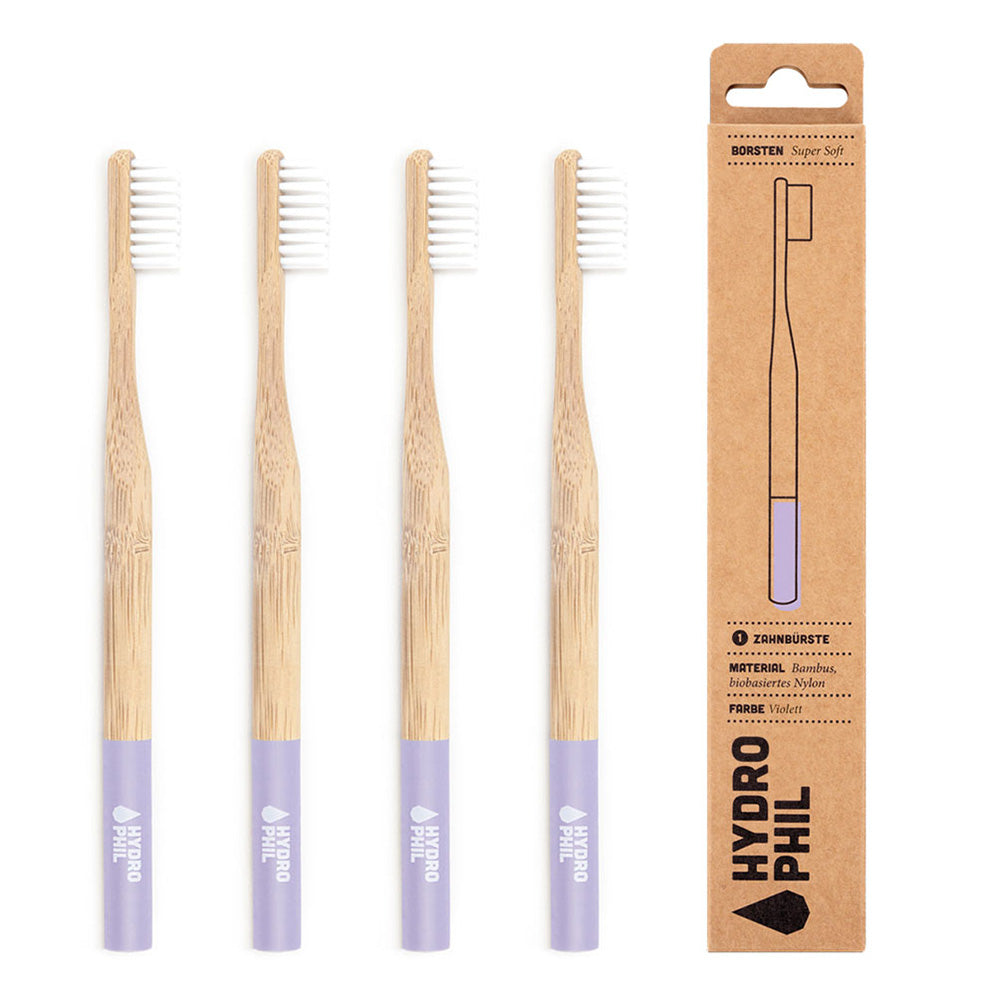 Purple Hydrophil Bamboo toothbrushes lined up on a white background.