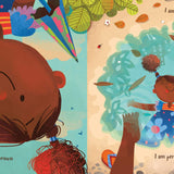 Pages of the I am Brown childrens book open on a white background