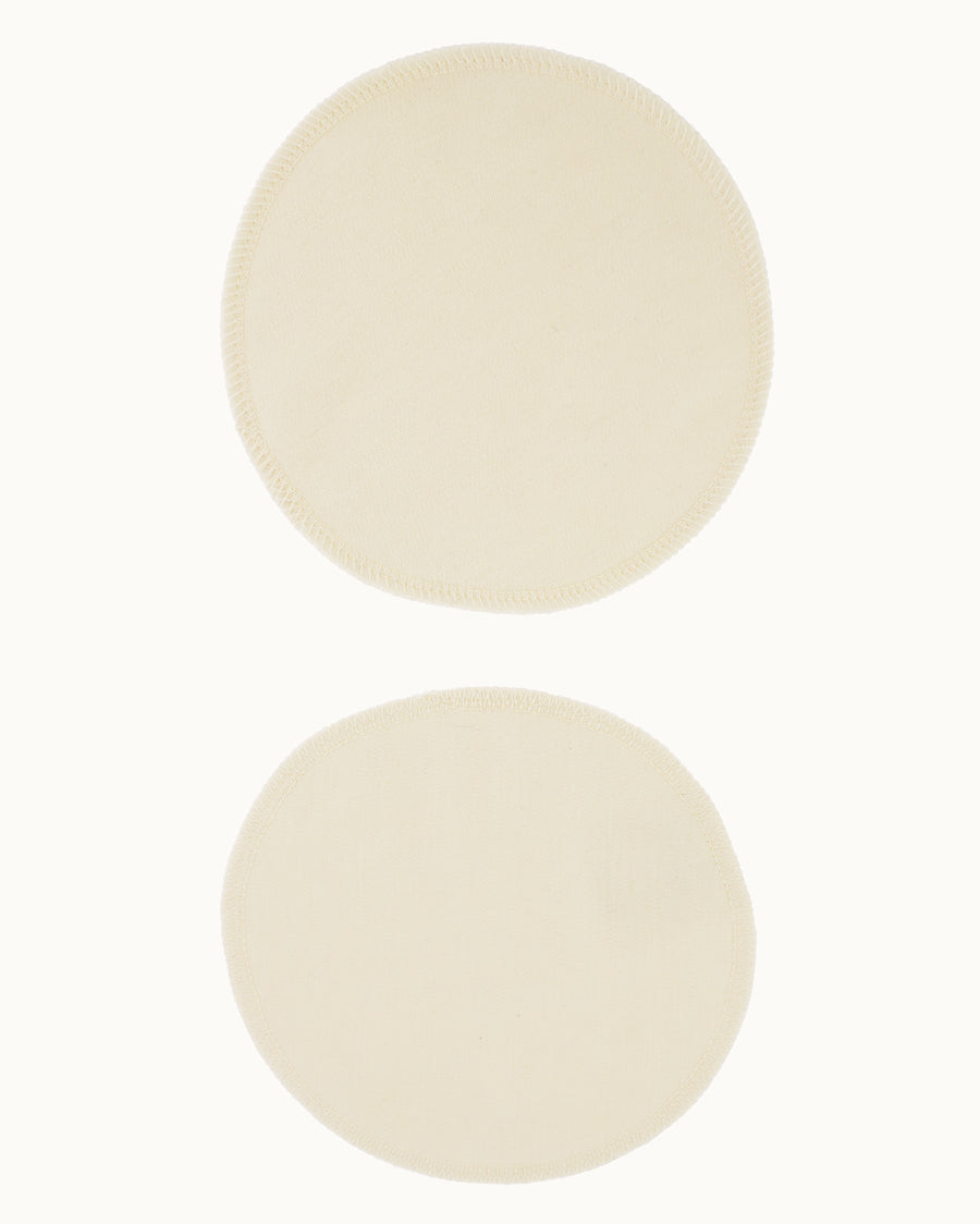 A pair of Imse Merino Wool Breast Warmer Pads pictured on a plain background