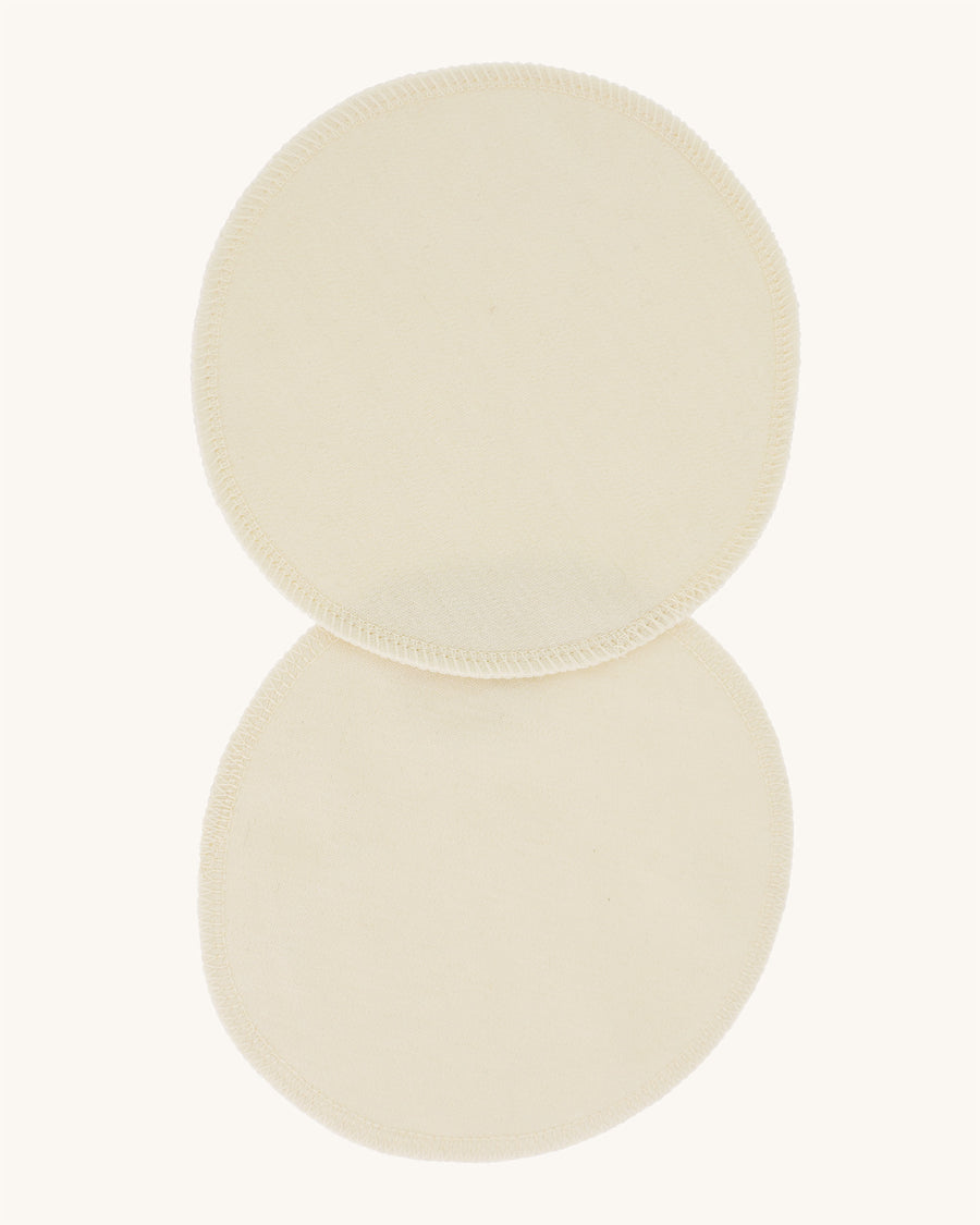 A pair of Imse Merino Wool Breast Warmer Pads pictured on a plain background