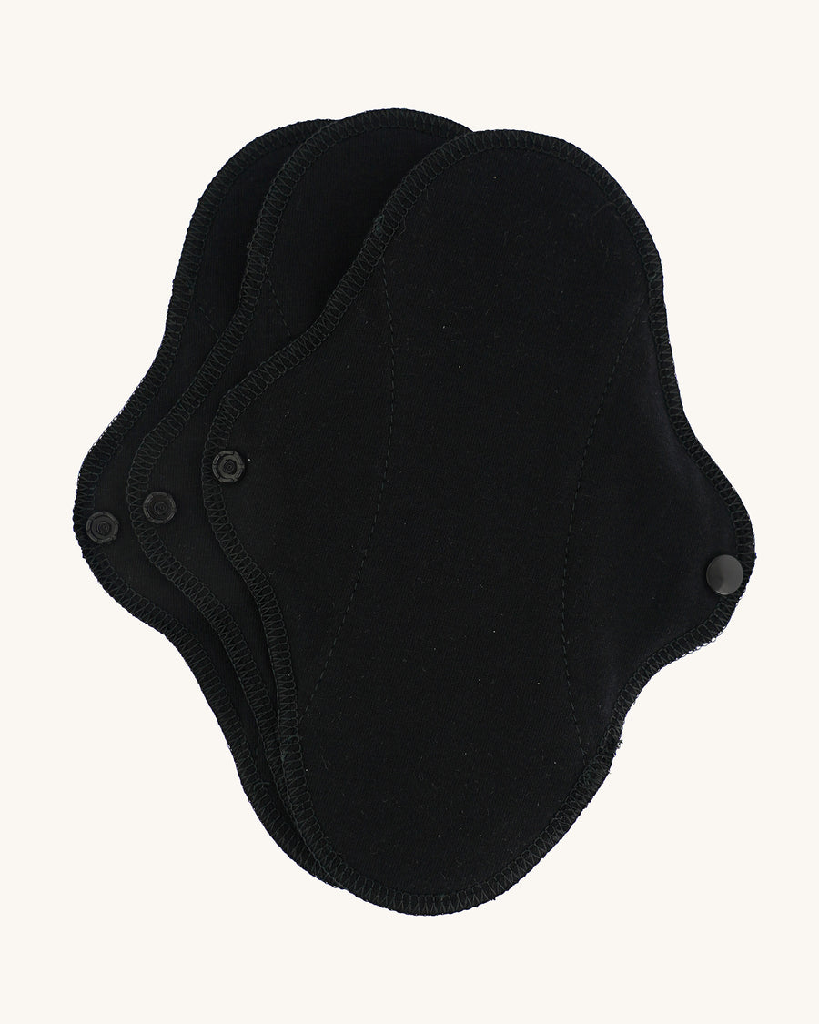 Imse Active reusable Black Organic Cotton Panty Liners in a 3 Pack, pictured on a plain background