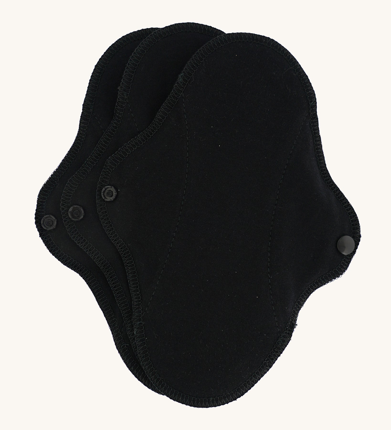 Imse Active reusable Black Organic Cotton Panty Liners in a 3 Pack, pictured on a plain background