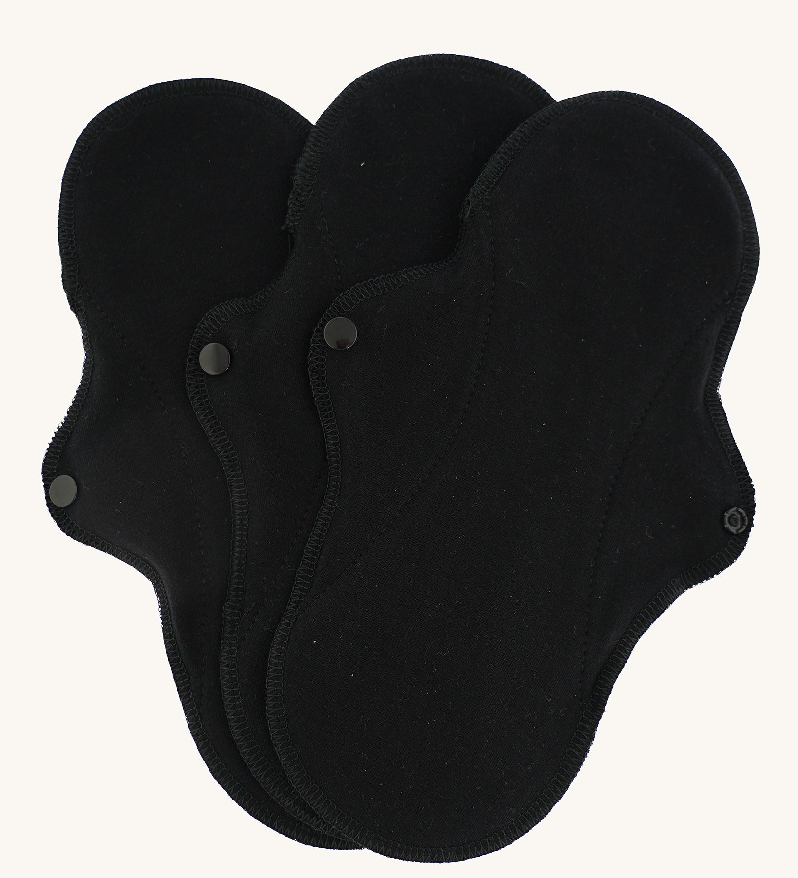 Imse Vimse black coloured Active Regular reusable Period Pads pictured on a plain background