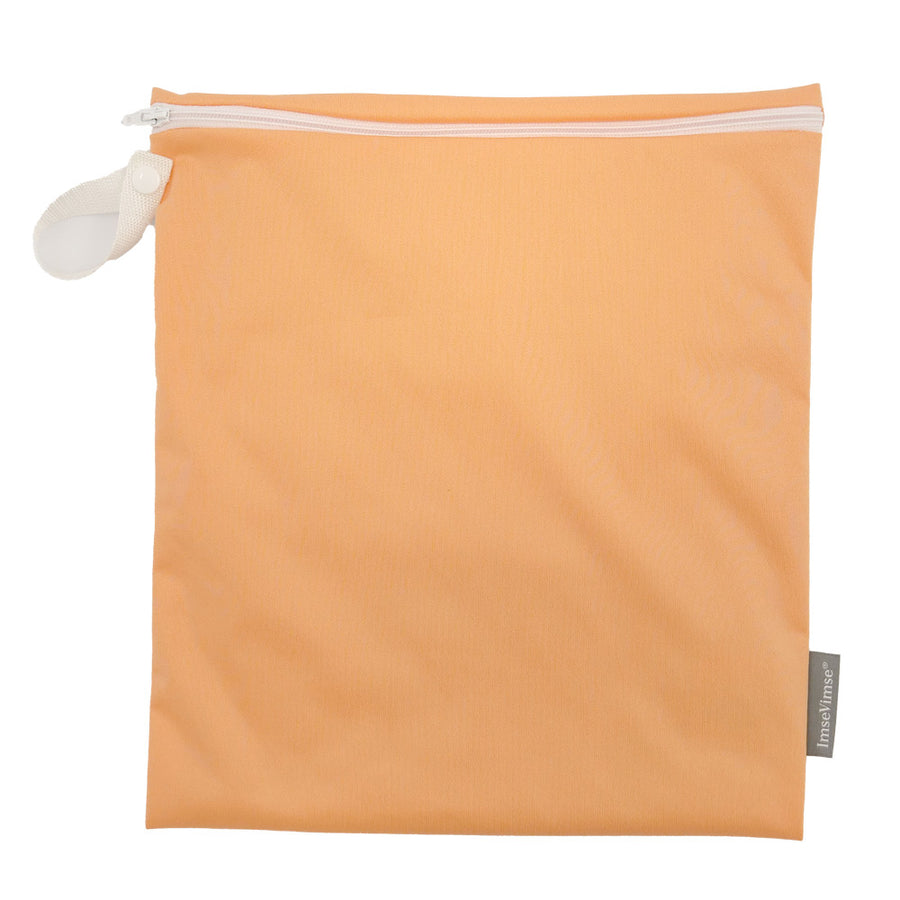 Imse Vimse medium size period pad wet bag in the peach colour on a white background