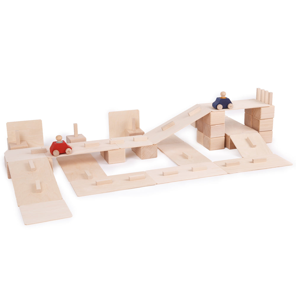 Just blocks childrens wooden toy blocks stacked into a road scene on a white background