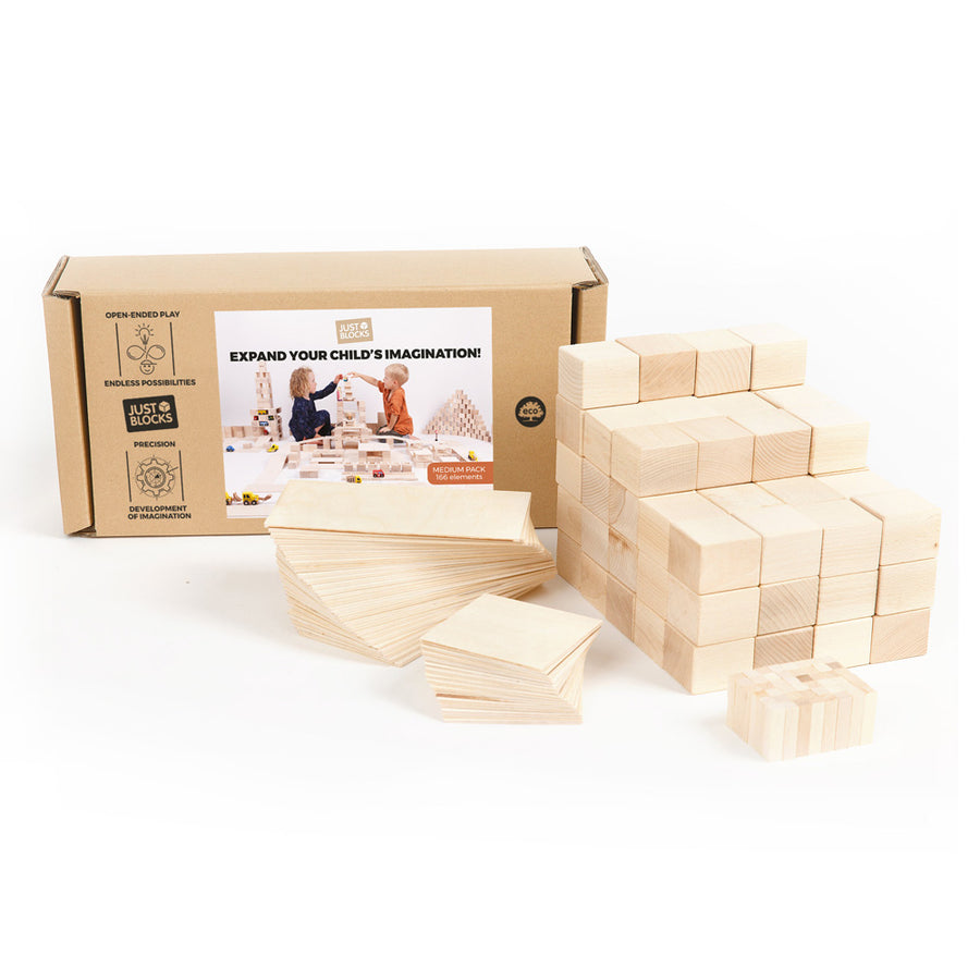 Just blocks eco-friendly childrens beech wood toy building blocks piled up on a white background next to their cardboard box