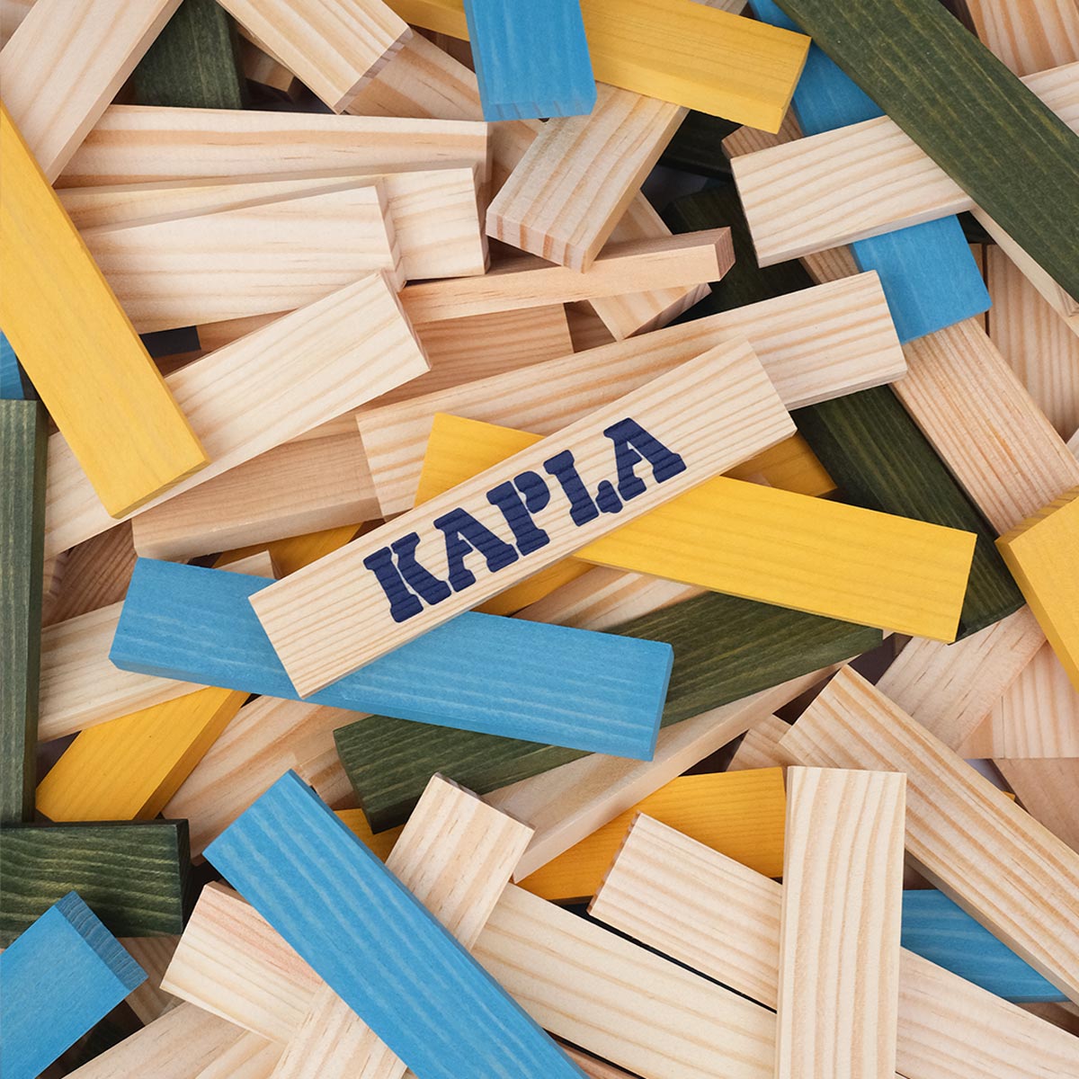 Kapla coloured wooden blocks stacked into the shape of a person on a white background