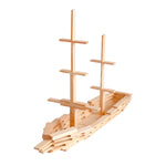 Kapla Waldorf building plank toys stacked in the shape of a sailing ship on a white background