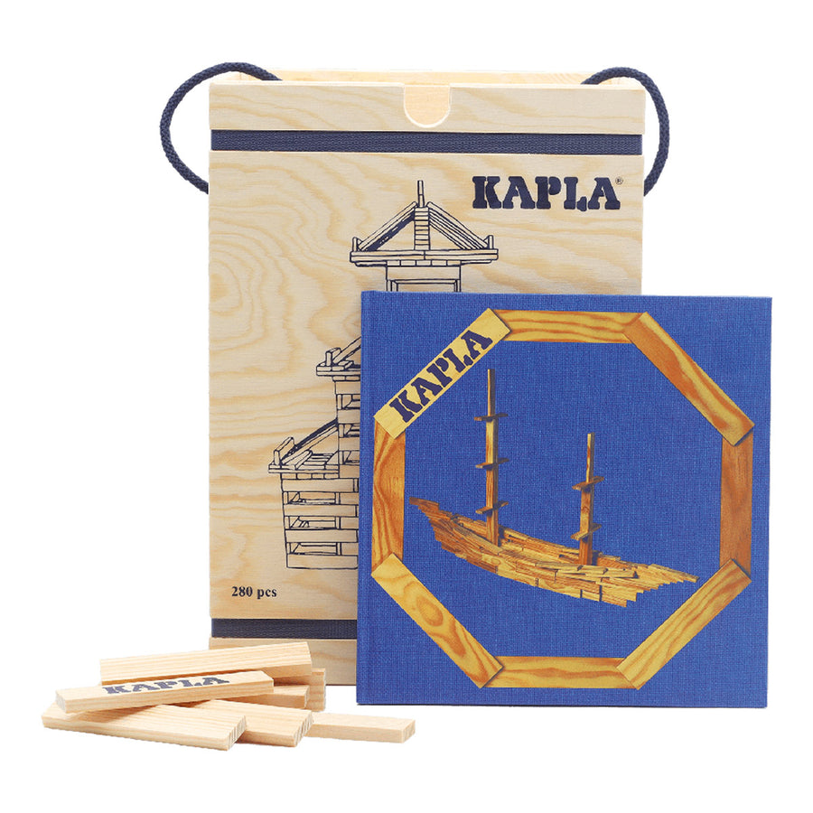 Kapla plastic-free wooden building blocks set with a blue building tips book on a white background