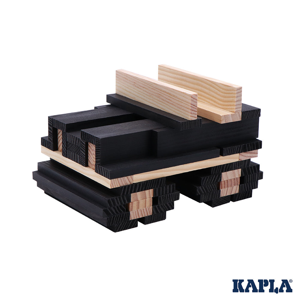 Kapla plastic-free wooden building blocks stacked into a jeep shape on a white background