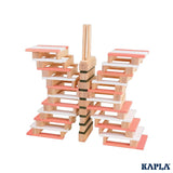 A butterfly shaped stack created using the wooden blocks from the KAPLA 200 Box wooden building planks in Spring colours