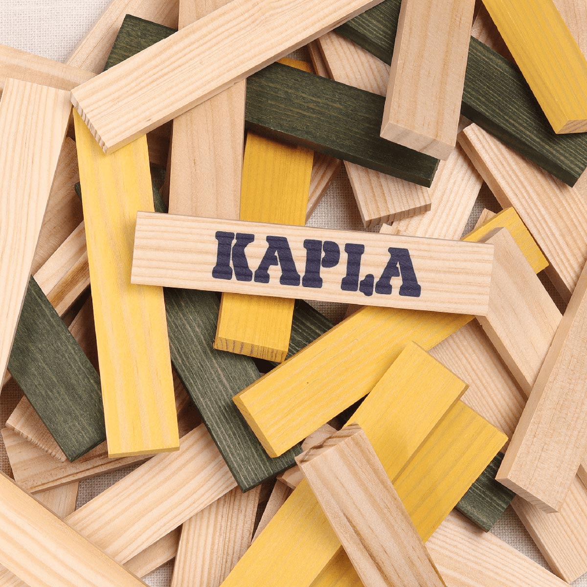 Close up of a pile of Kapla Waldorf stacking blocks in the natural