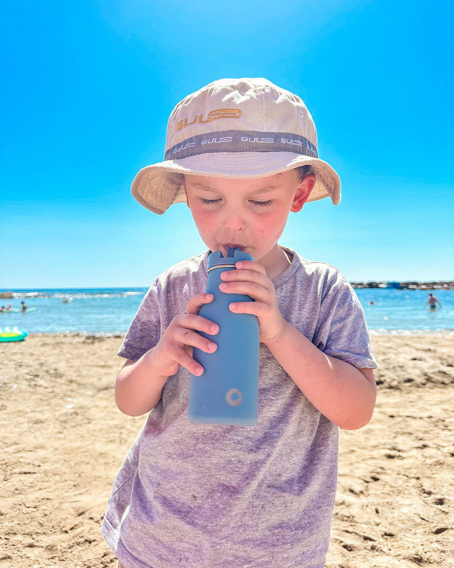 A child enjoying a day out on the beach in the sun