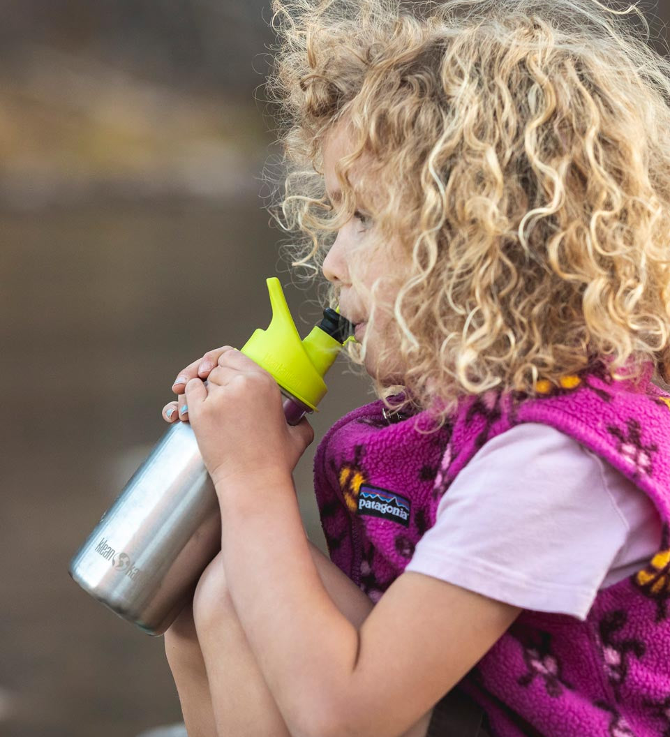 Close up of girl drinking from the Klean Kanteen kid's 12oz stainless steel drinks bottle 