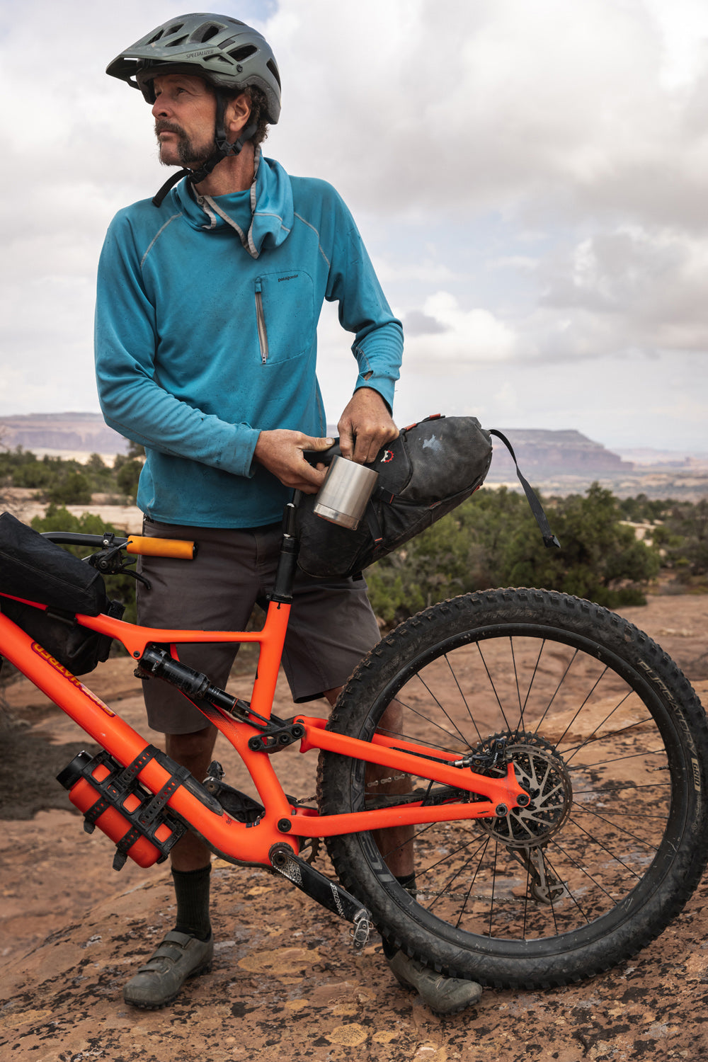  opening the lid of their Klean Kanteen 12oz Camping Mug in Stainless Steel