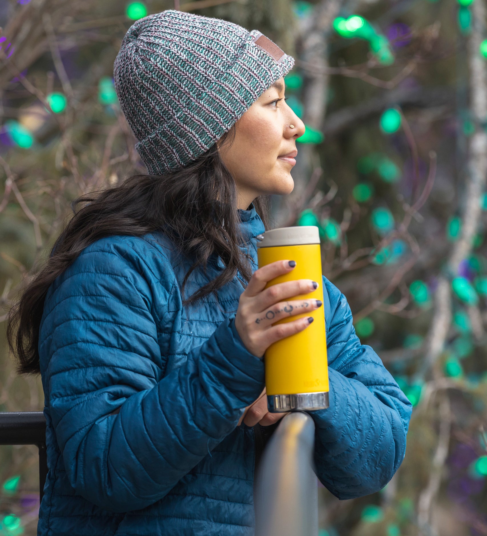 A person holding a Klean Kanteen 16oz TKWide in aSunset yellow colour with taupe Cafe cap. 