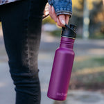 Close up of a girls hand holding the Klean Kanteen 18oz metal drinks bottle