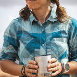 An adult holding their Klean Kanteen 12oz Stainless Steel Camping Mug in their hands