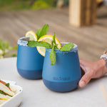 Close up of a hand holding a Klean Kanteen blue insulated wine tumbler