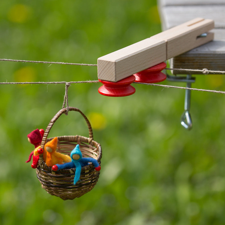 Image showing three small dolls in a wicker Basket Cable Car