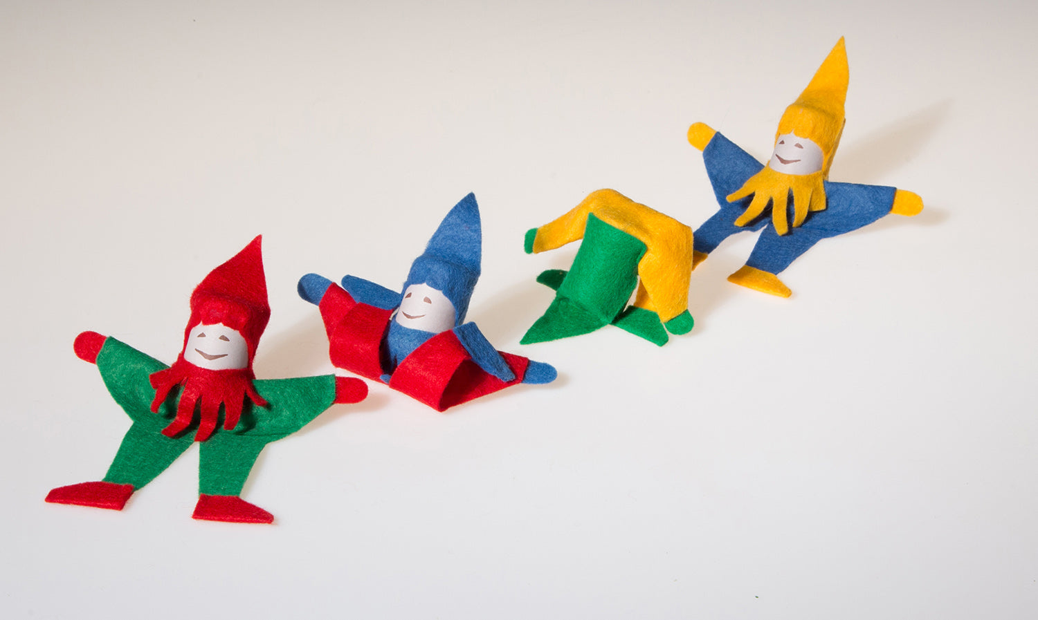 Four Kraul Tumbling Gnomes in various tumbling phases.