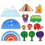 A set of 13 wooden toys from the Dan Y Ser Lanka Kade babipur collaboration collection pictured on a plain background. 