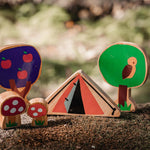 Close up of the Lanka Kade Babipur parbell dan y ser tent toy on a mossy rock next to the babipur tree and toadstool toys