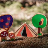 Close up of the Lanka Kade Babipur parbell dan y ser tent toy on a mossy rock next to the babipur tree and toadstool toys