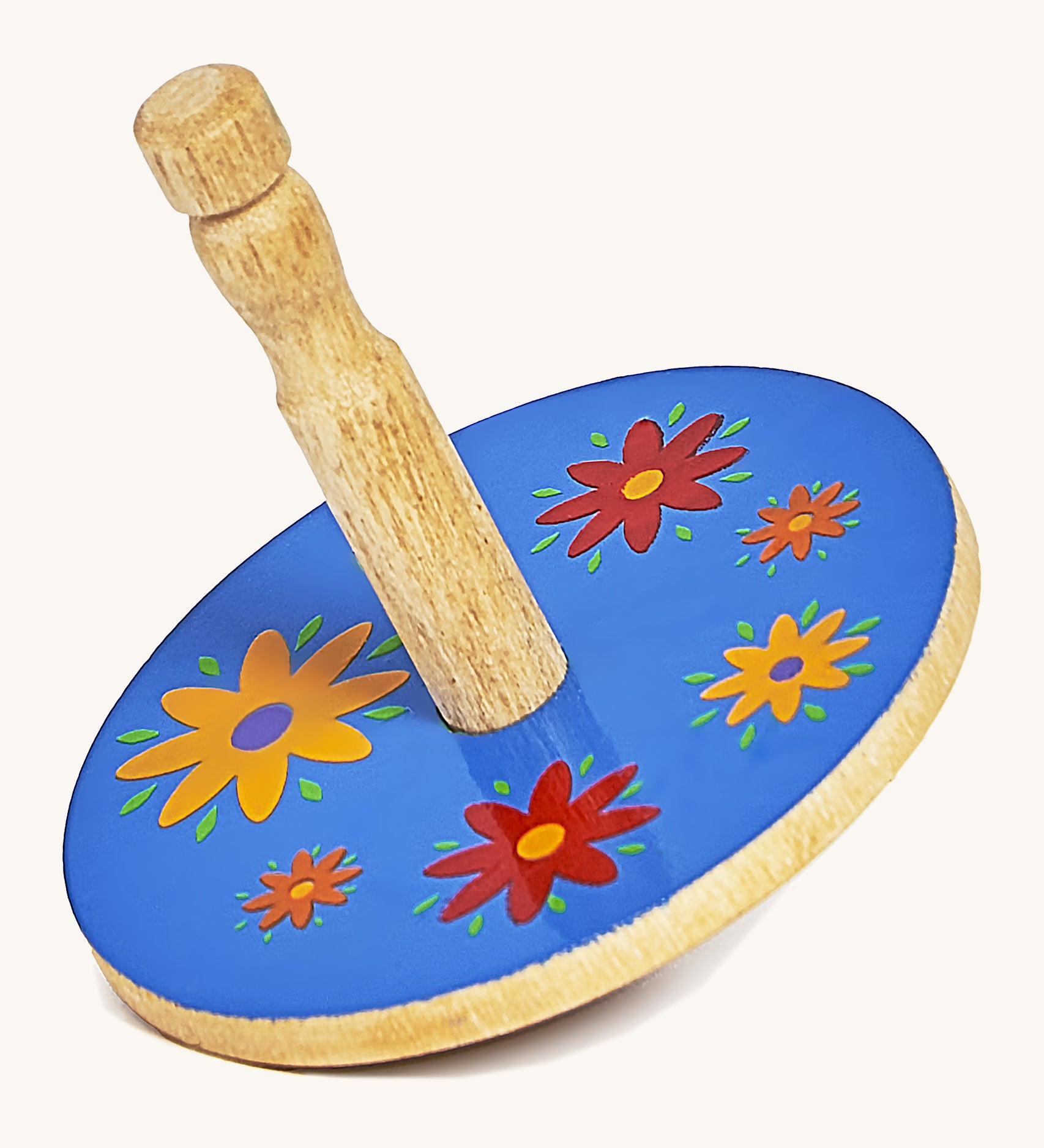 A yellow wooden Lanka Kade spinning top with red and yellow flowers on a cream background.