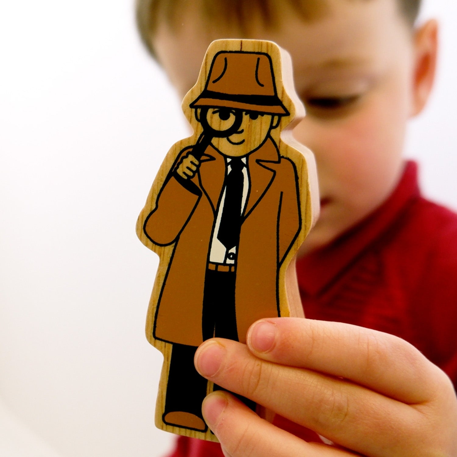 A child plays with the Lanka Kade Brown Detective.