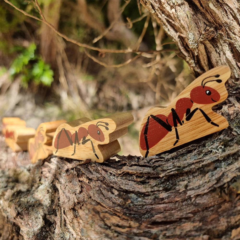 Close up of some Lanka Kade brown ant toy figures on a tree branch