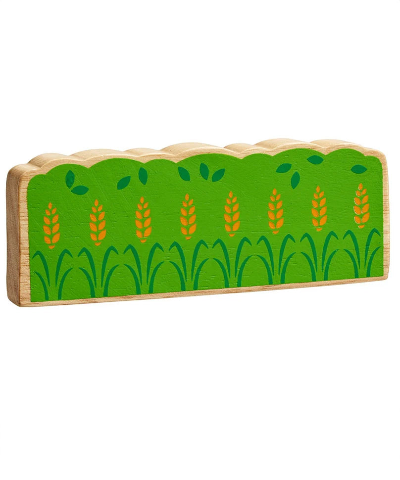 Lanka Kade green wooden hedge toy on a plain background. The hedge is green with darker green leaf details and yellow wheat. 