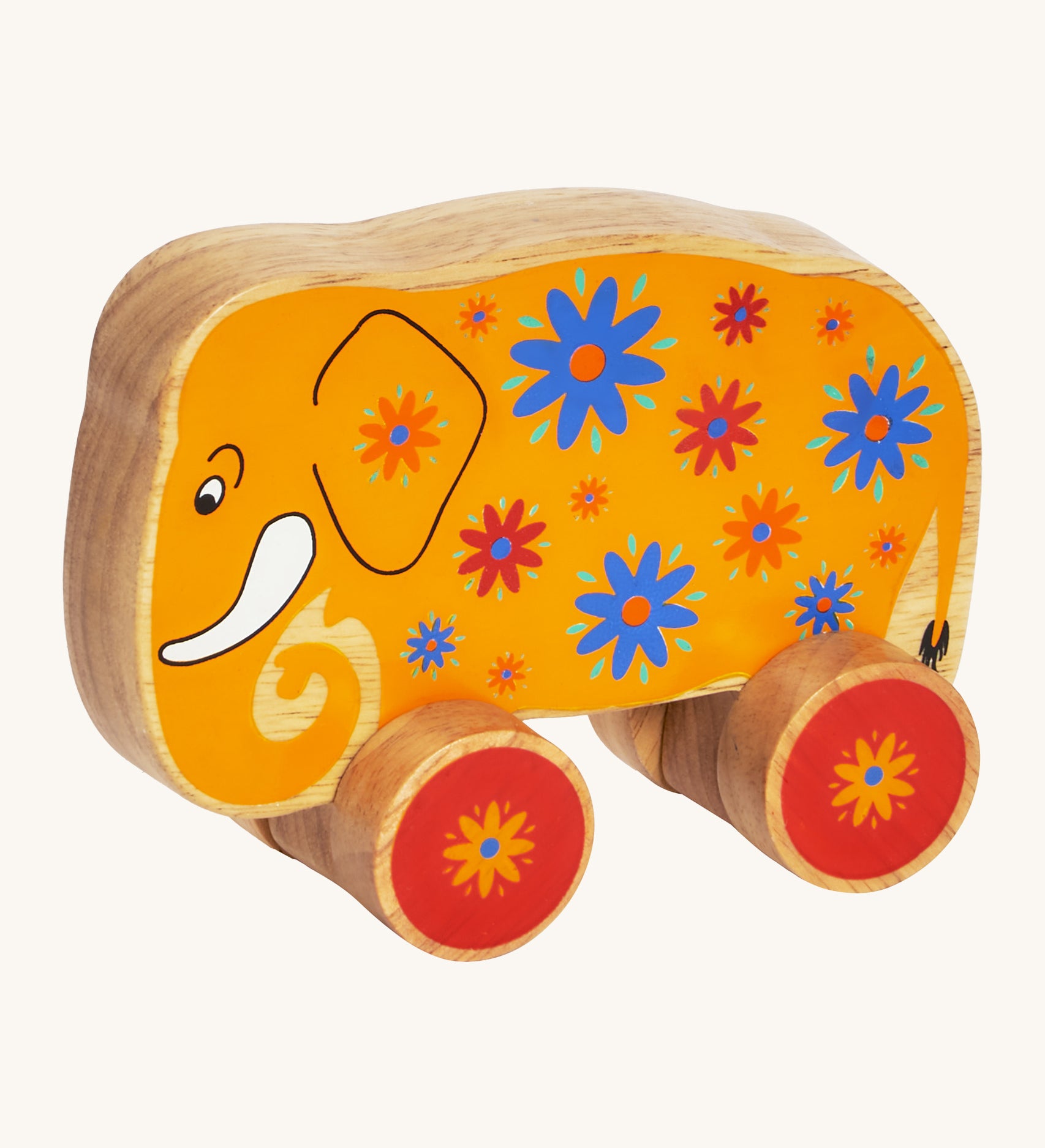 A yellow wooden Lanka Kade push along elephant with blue and red flowers with red wheels on a cream background.