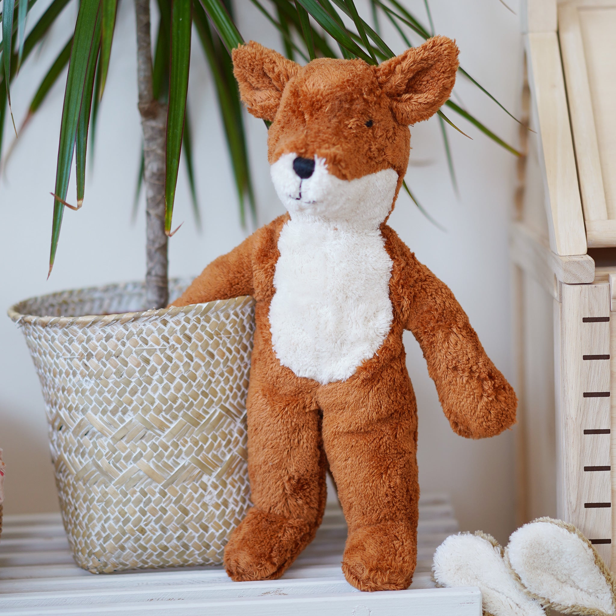 Senger Small Floppy Fox Toy. Sustainably-produced cotton and high-quality long-staple mohair that can easily be combed. The fox has a ginger body with a white belly and face from the nose down. On a cream background