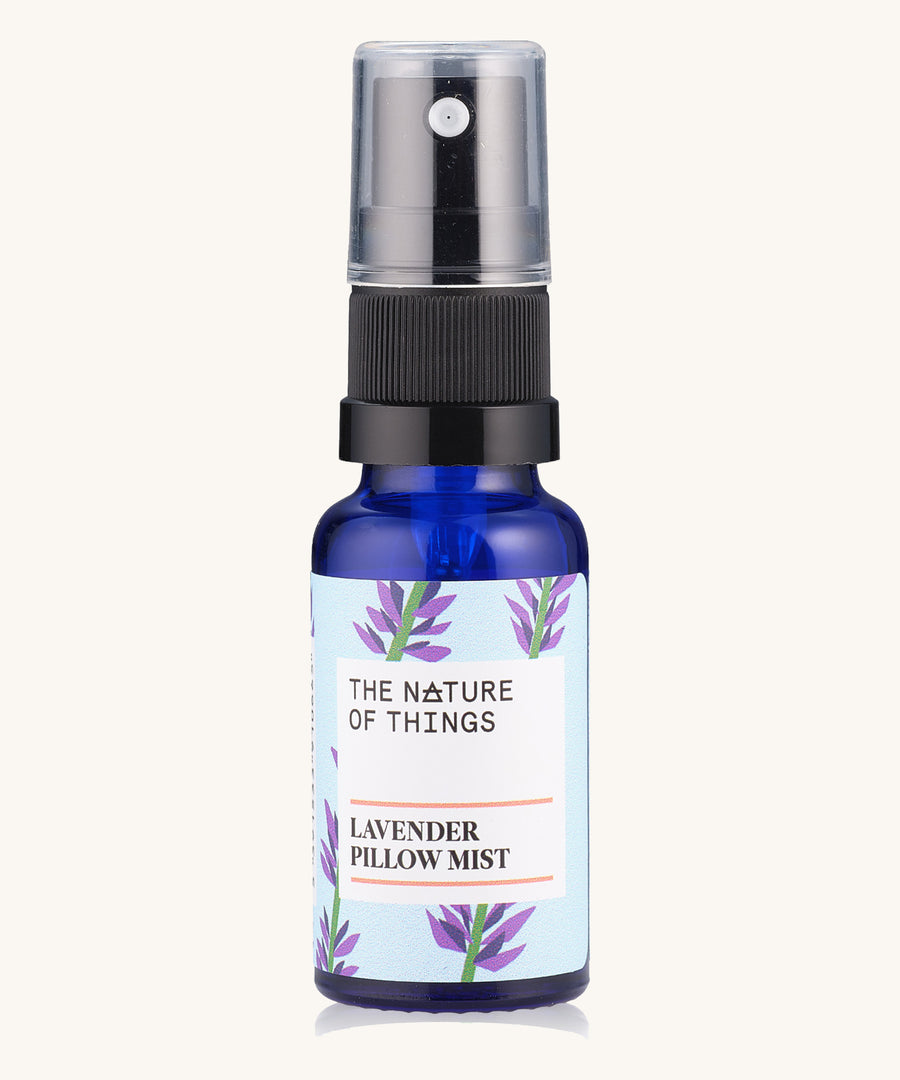 Lavender Sleep Pillow Mist pure essential oil in a blue glass bottle with a spray cap.