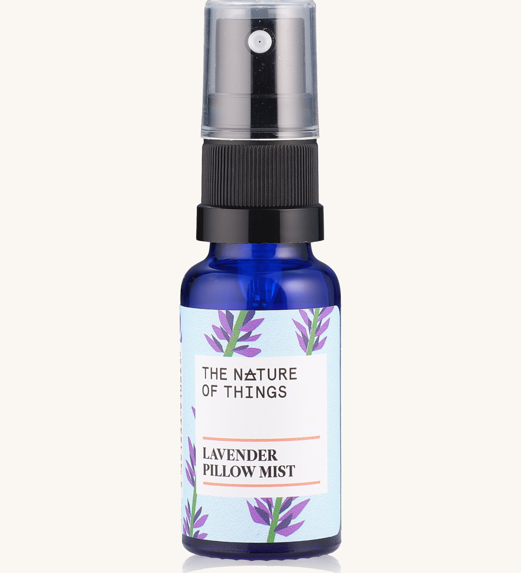 Lavender Sleep Pillow Mist pure essential oil in a blue glass bottle with a spray cap.