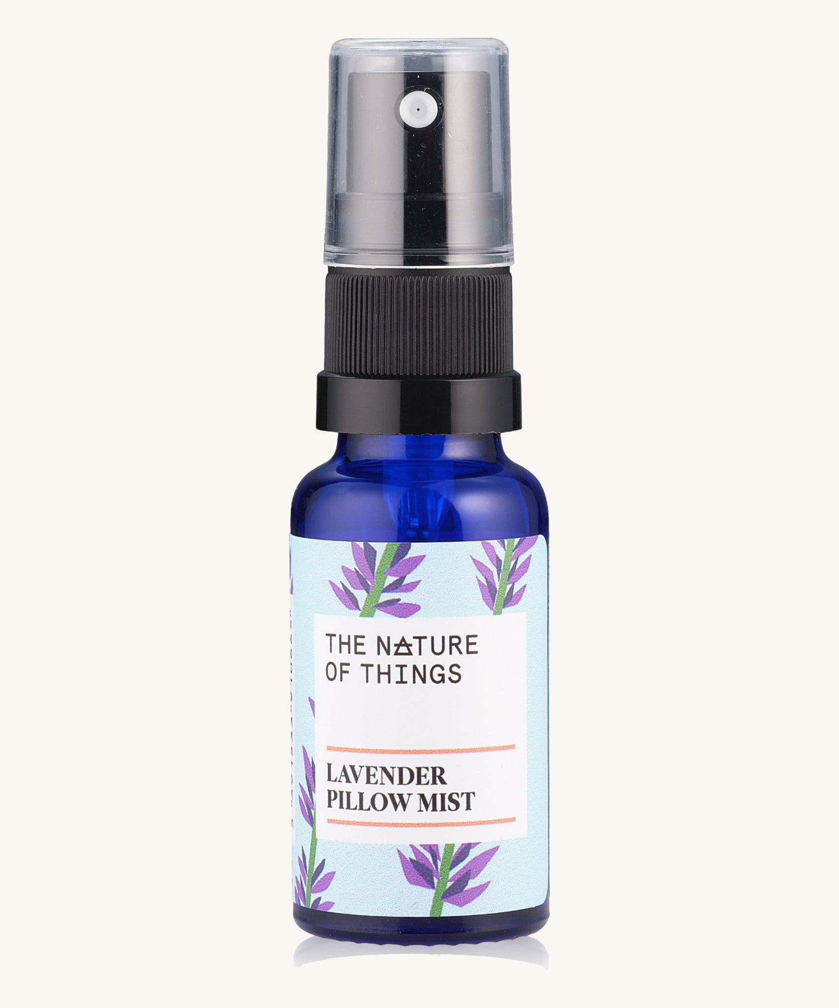 Lavender Sleep Pillow Mist pure essential oil in a blue glass bottle with a spray cap.