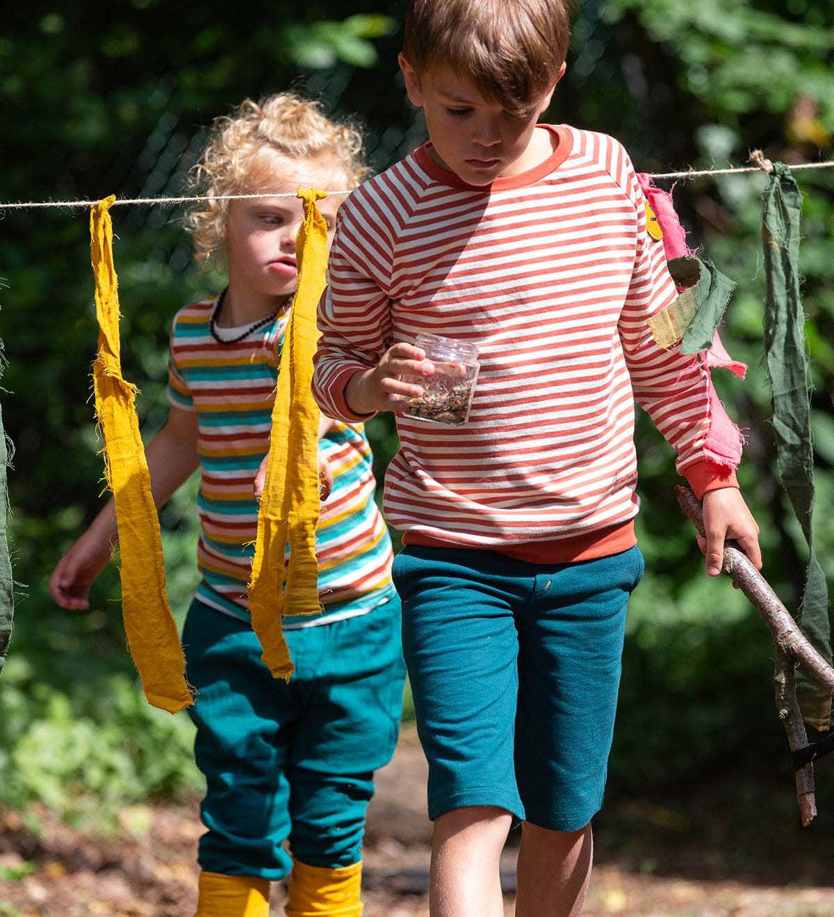  they comfy blue shorts have two pockets and an orange drawstring cord in the waistband