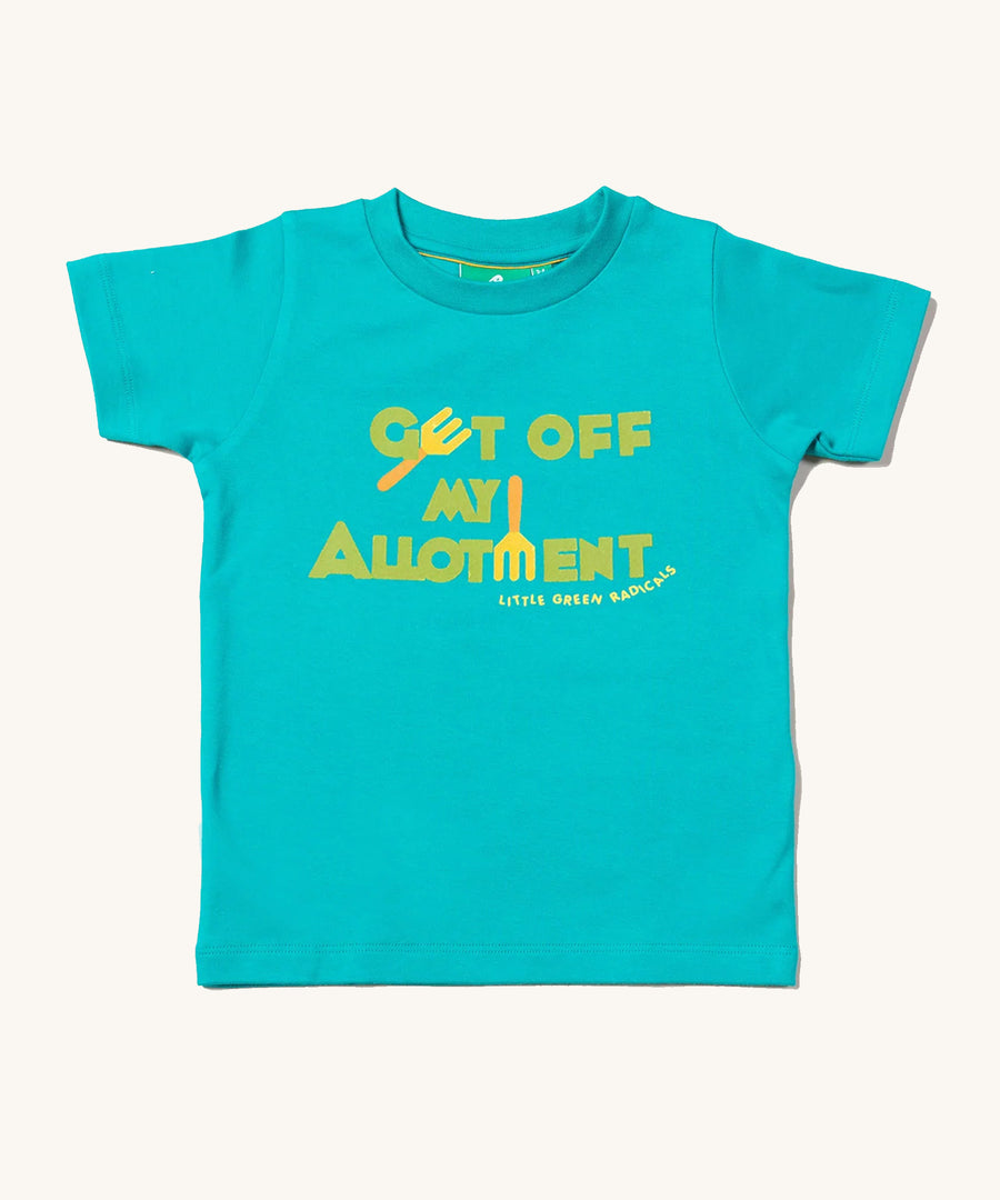 Little Green Radicals Allotment Top, made from organic cotton with a light blue fabric, and green and yellow lettering on a cream background