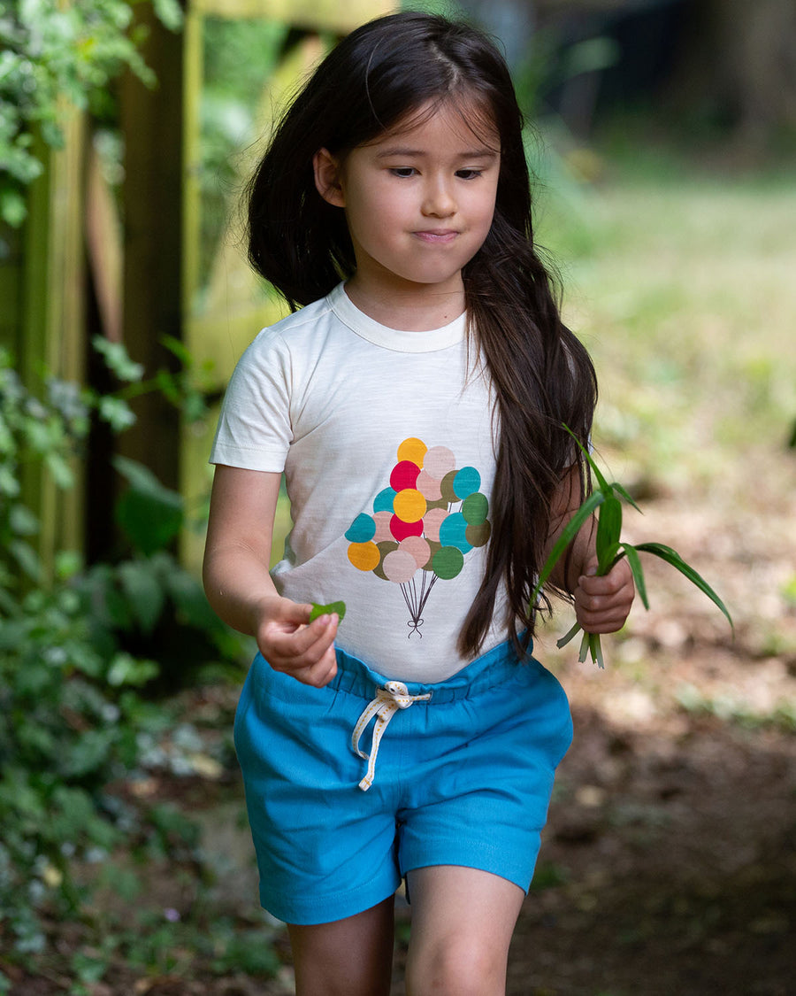  these beautiful blue shorts have pockets and a white and yellow drawstring cord in the waistband