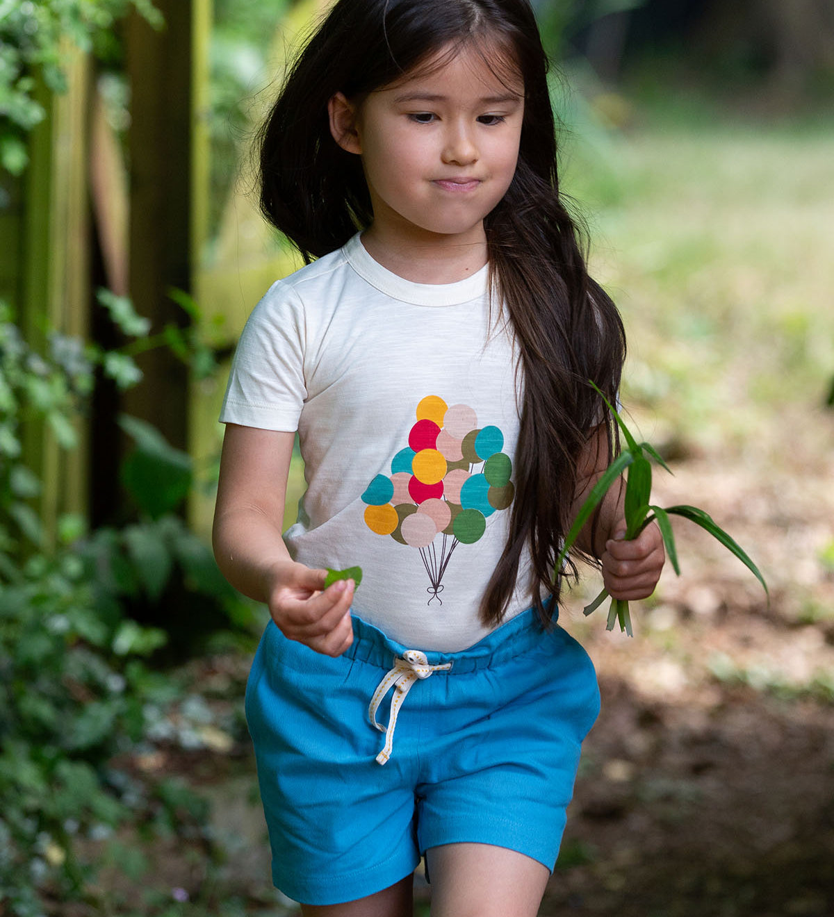  these beautiful blue shorts have pockets and a white and yellow drawstring cord in the waistband