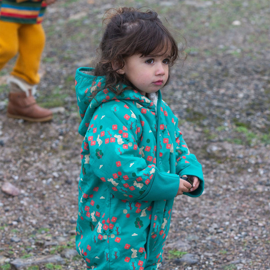 A young child wears the LGR Forest Walk Sherpa Fleece Snowsuit in an outdoor setting.