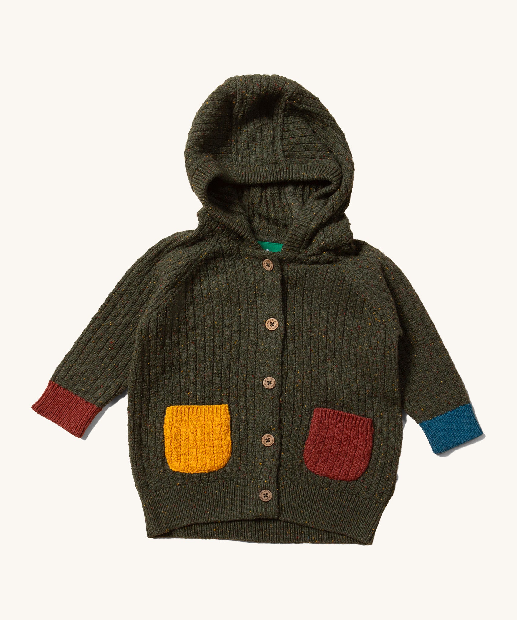 Little Green Radicals kids fern green knitted hooded cardigan with yellow and red pockets on a cream background.