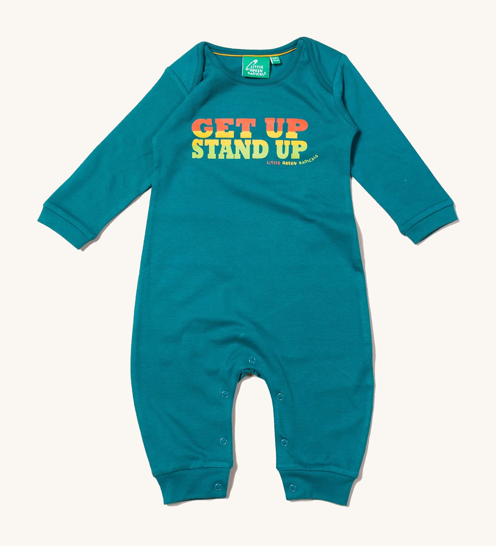 Little Green Radicals Get Up Stand Up Organic Cotton Playsuit in a turquoise coloured fabric, with orange, yellow and green lettering on a cream background