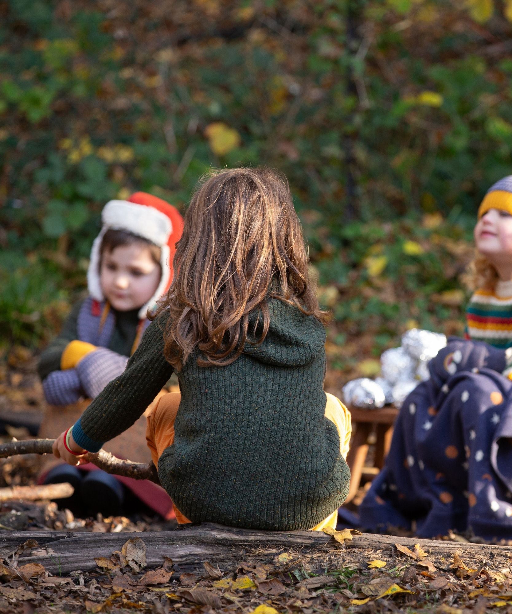 Little Green Radicals kids fern green knitted hooded cardigan with yellow and red pockets back detail